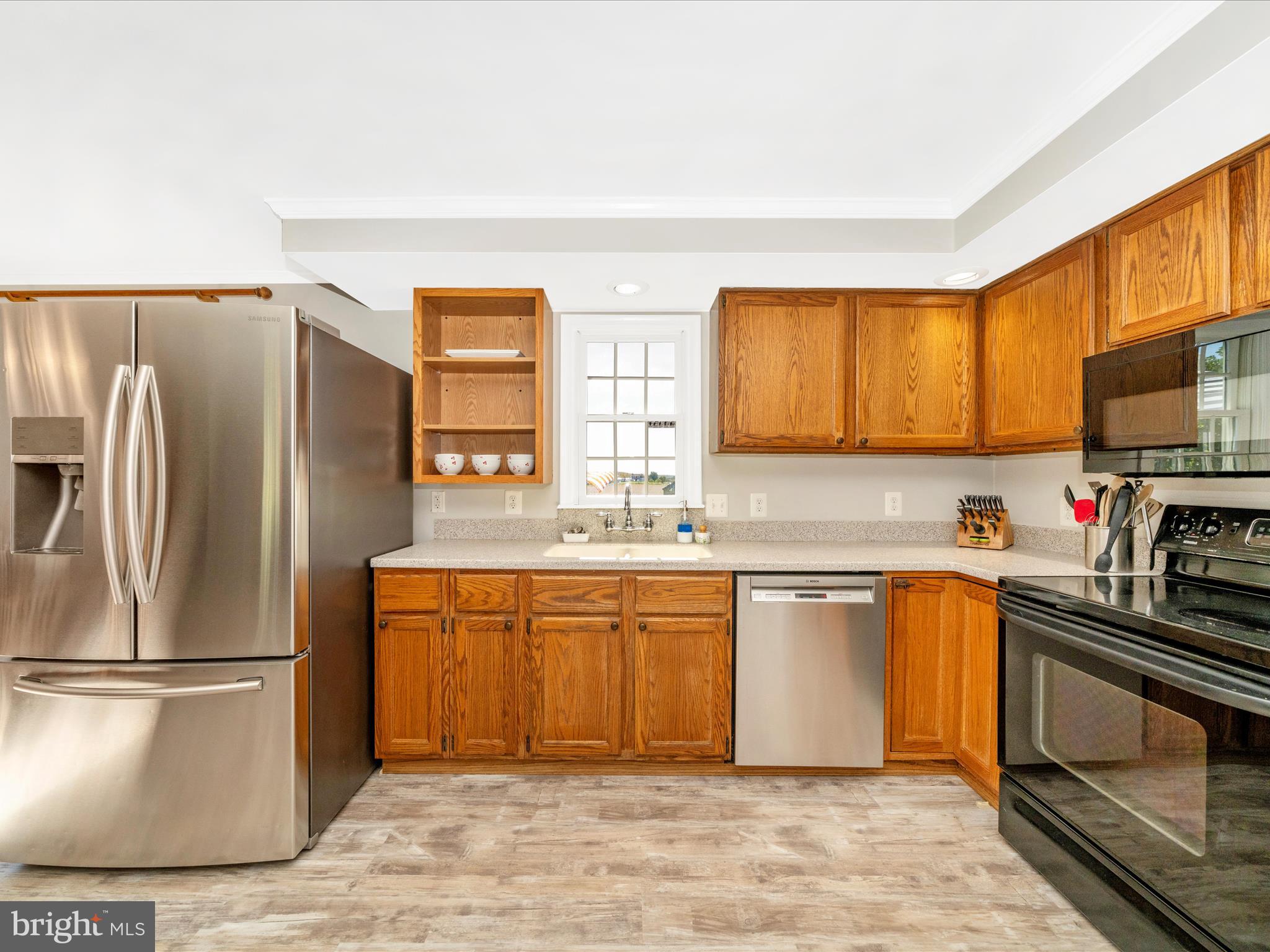 2684 Lydia Court Adamstown, MD 21710 - Photo 17 of 44 a kitchen with stainless steel appliances granite countertop a refrigerator stove top oven and sink