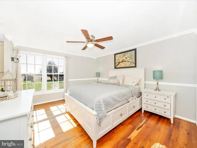 a bed room with a bed and a chandelier