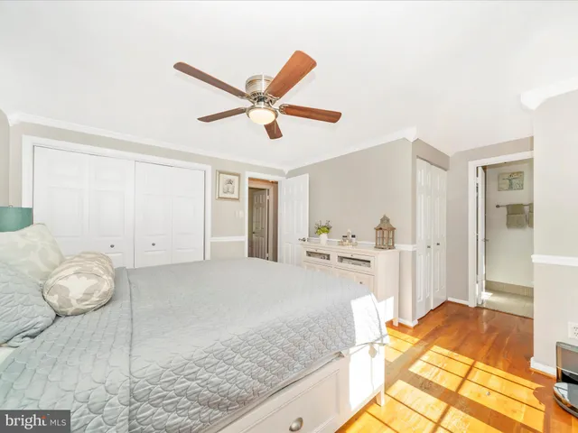 a en suite bathroom with a toilet a mirror and a sink