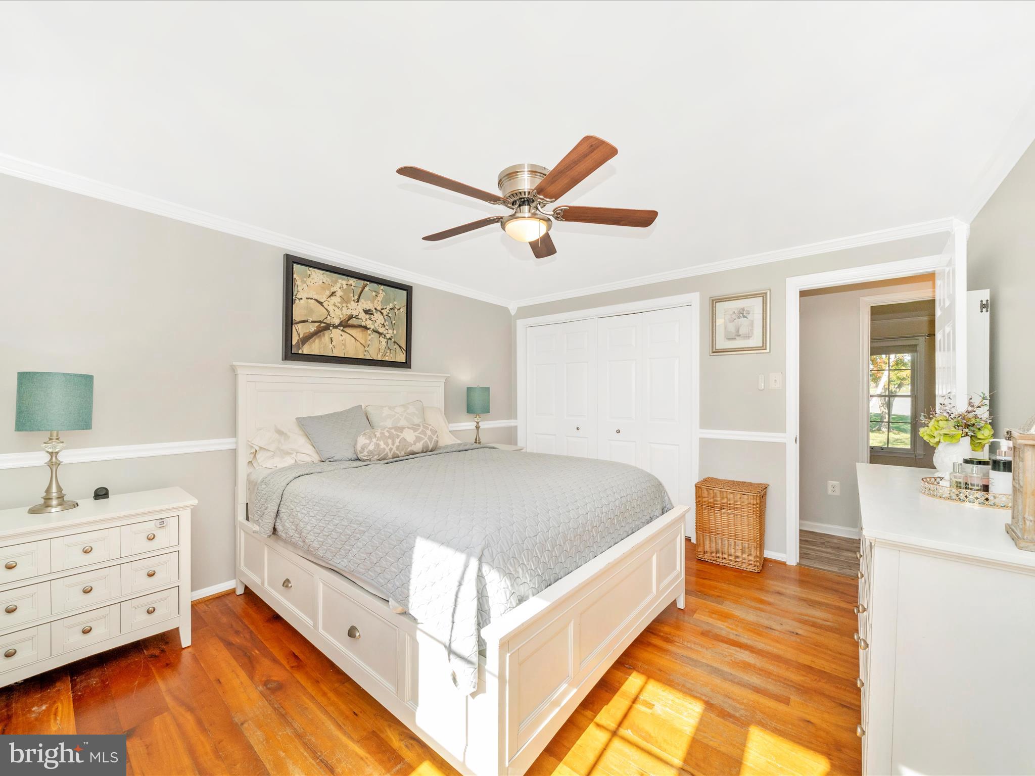 2684 Lydia Court Adamstown, MD 21710 - Photo 20 of 44 a bed room with a bed and a chandelier