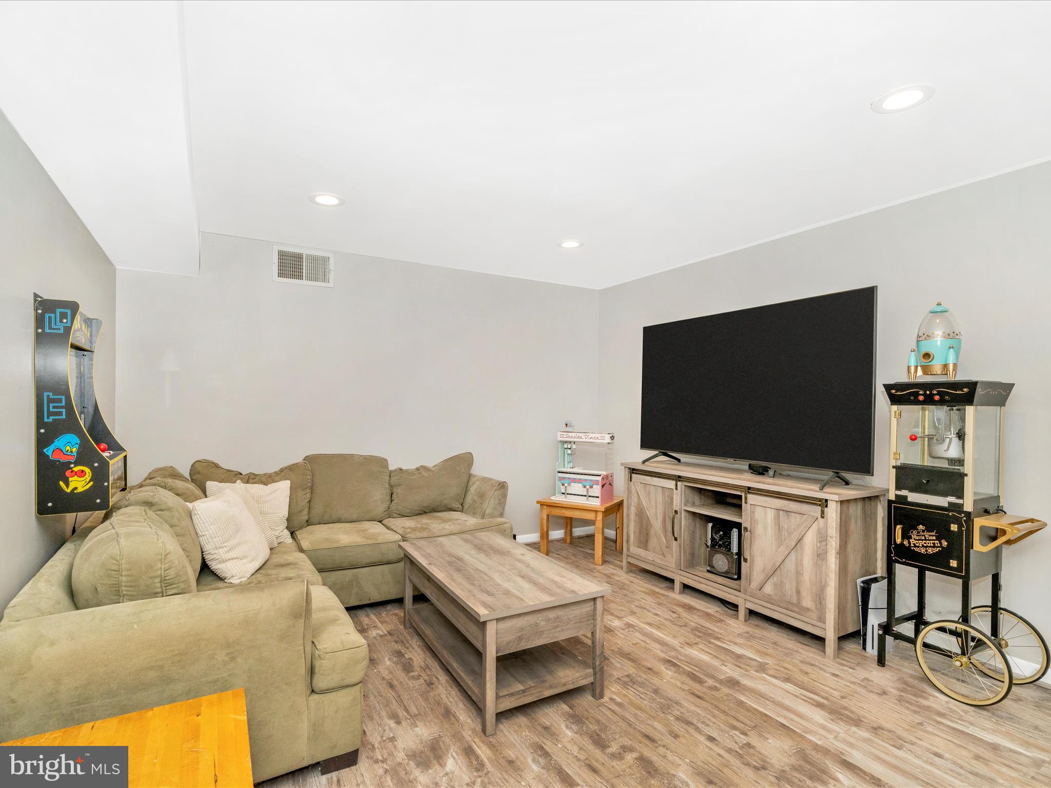 2684 Lydia Court Adamstown, MD 21710 - Photo 36 of 44 a living room with furniture and a flat screen tv