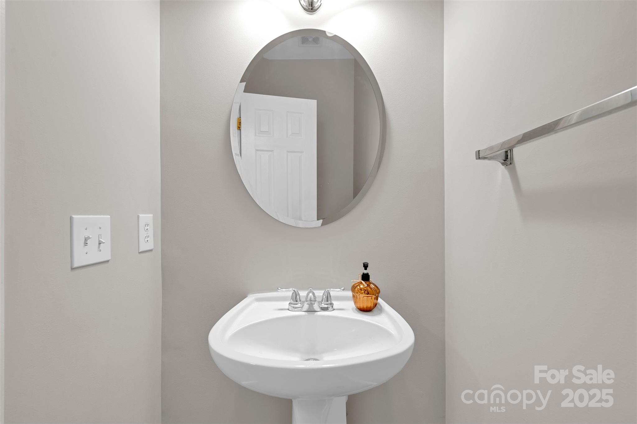 9211 Hickory Tree Lane Charlotte, NC 28277 - Photo 23 of 46 a bathroom with a sink and a mirror