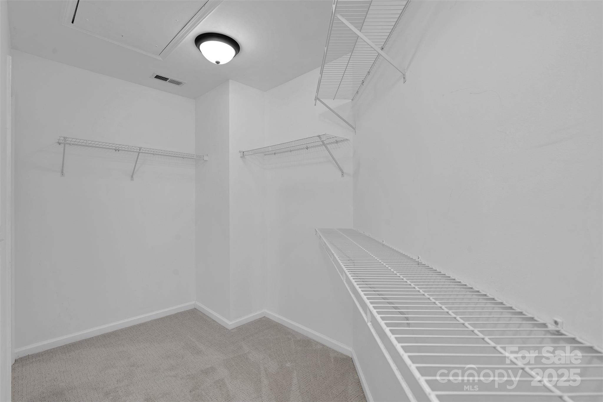 9211 Hickory Tree Lane Charlotte, NC 28277 - Photo 32 of 46 a view of a room with racks on the wall