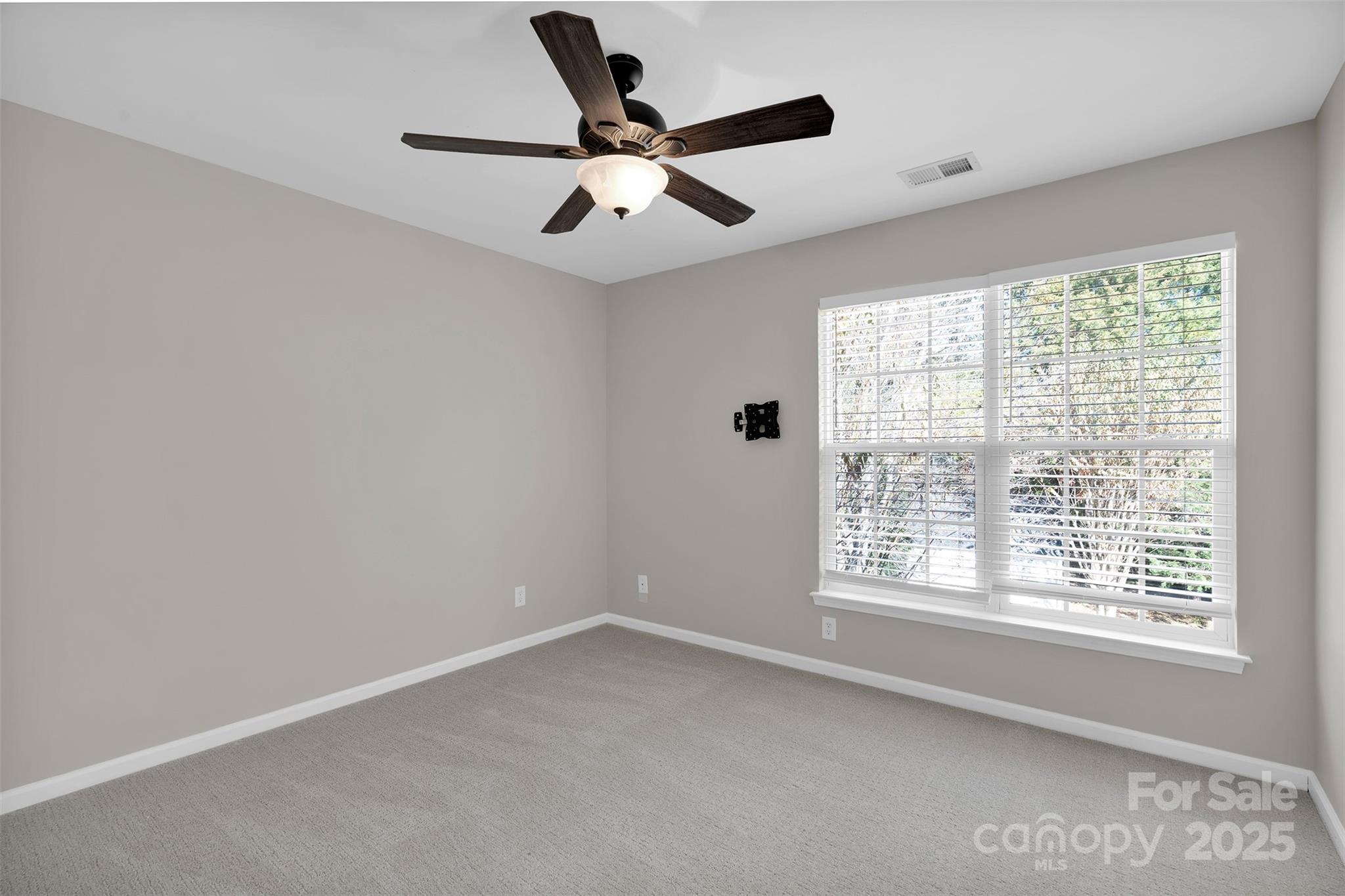 9211 Hickory Tree Lane Charlotte, NC 28277 - Photo 37 of 46 a view of an empty room with a window