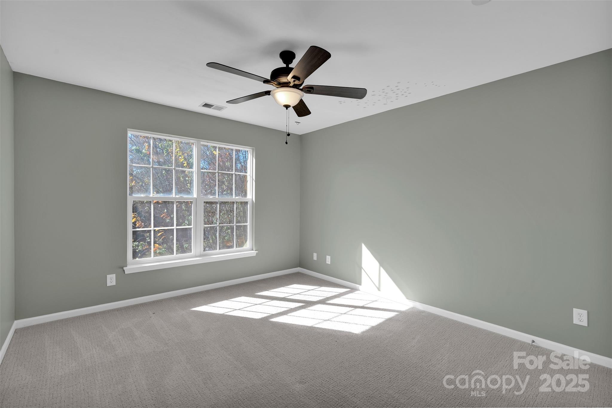 9211 Hickory Tree Lane Charlotte, NC 28277 - Photo 38 of 46 a view of empty room with wooden floor and fan
