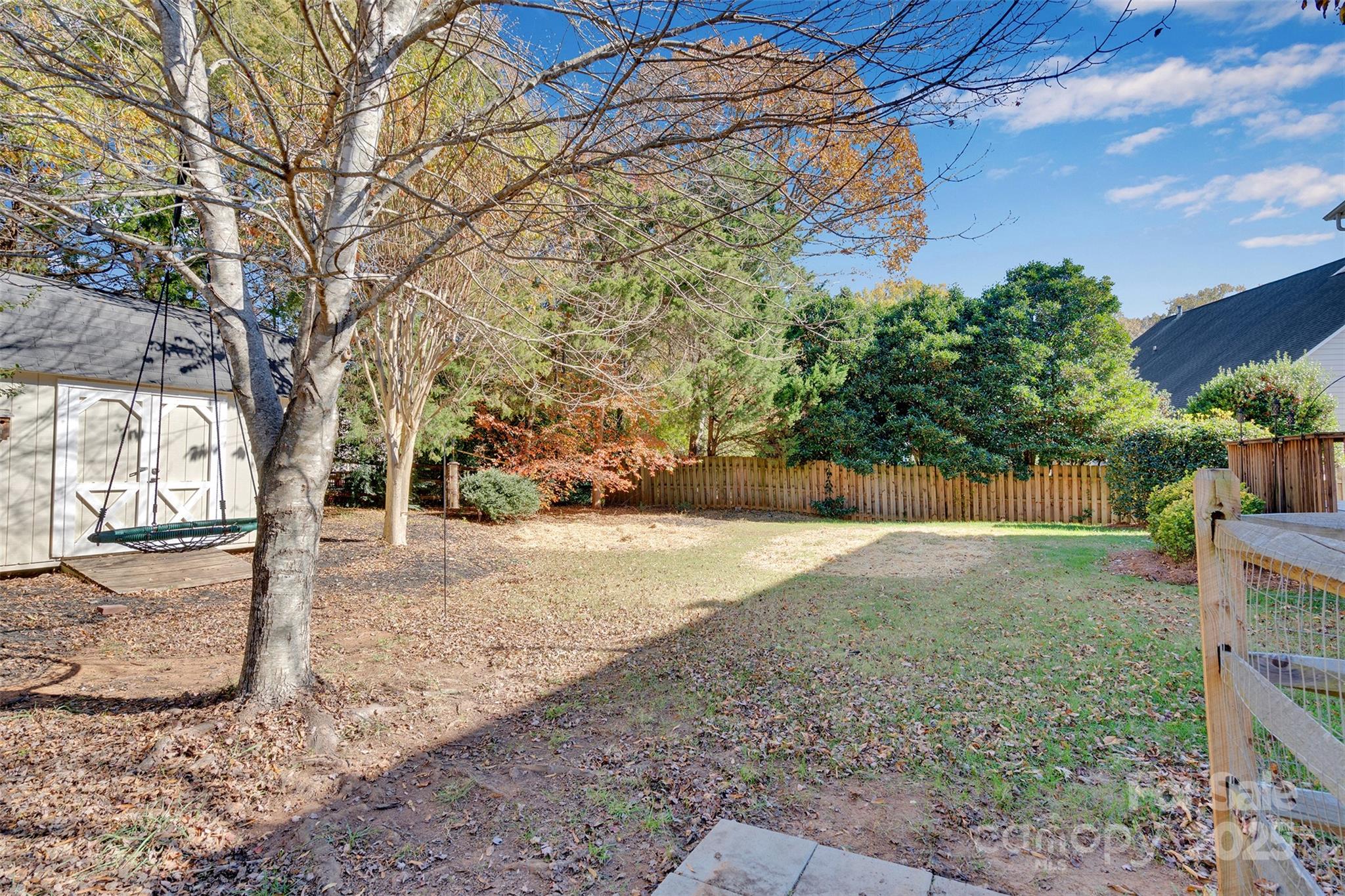 9211 Hickory Tree Lane Charlotte, NC 28277 - Photo 41 of 46 a view of a yard with plants and trees