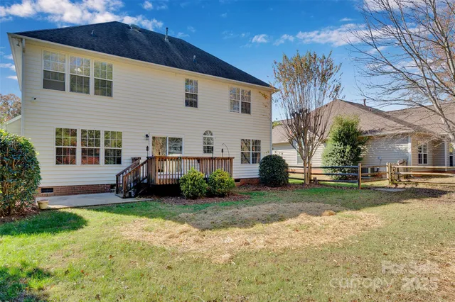 a view of a house with a yard and plants