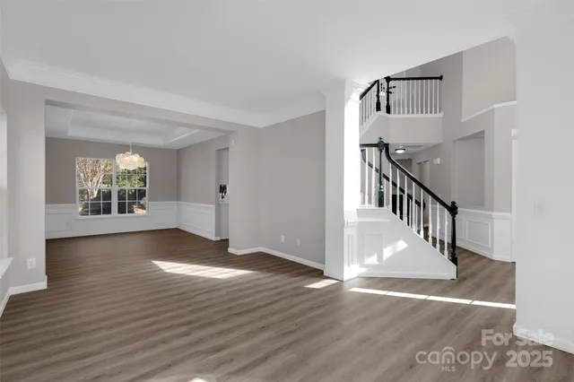a view of an entryway with wooden floor