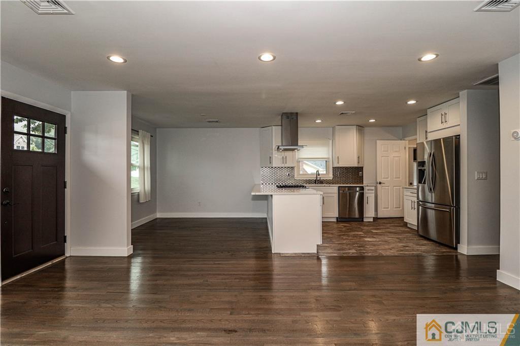 578 Chain O' Hills Road Colonia, NJ 07067 - Photo 14 of 39 a kitchen with a refrigerator and a microwave