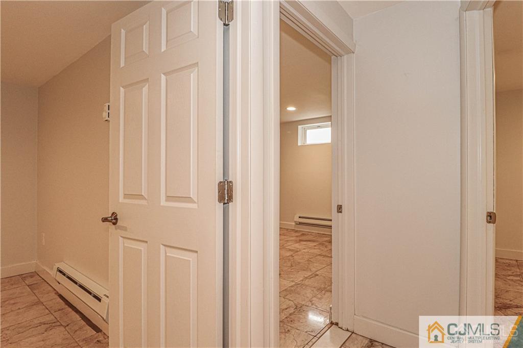 578 Chain O' Hills Road Colonia, NJ 07067 - Photo 21 of 39 a view of a hallway with wooden floor