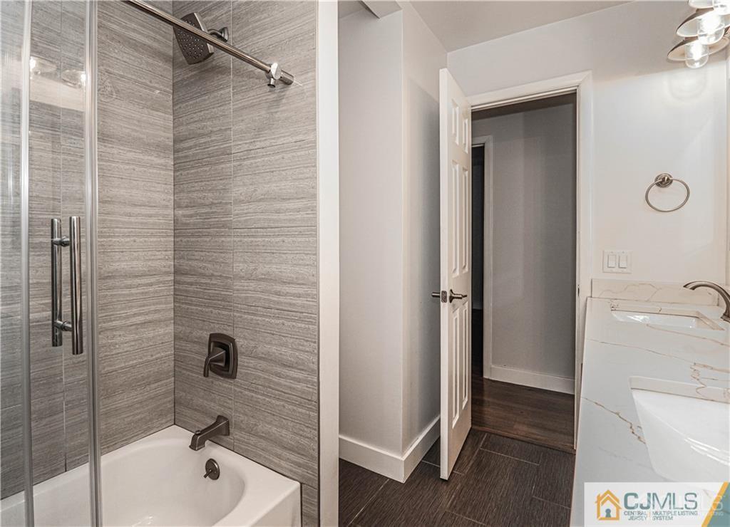 578 Chain O' Hills Road Colonia, NJ 07067 - Photo 28 of 39 a bathroom with a bathtub and shower
