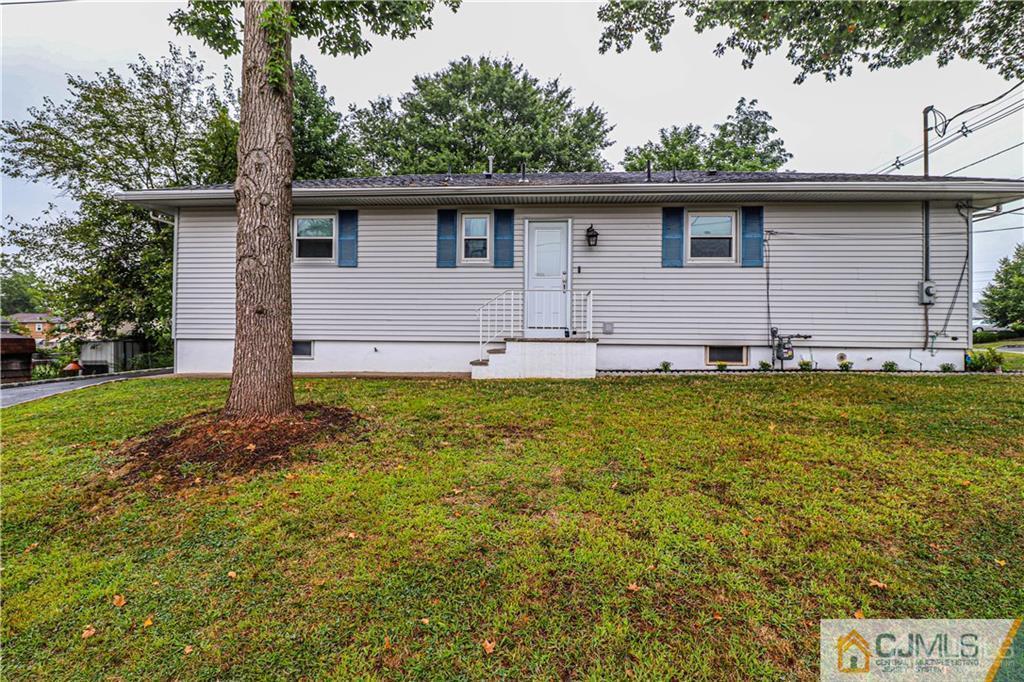 578 Chain O' Hills Road Colonia, NJ 07067 - Photo 37 of 39 a front view of house with yard and trees