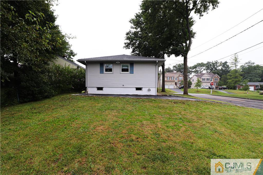 578 Chain O' Hills Road Colonia, NJ 07067 - Photo 38 of 39 a view of a house with a big yard
