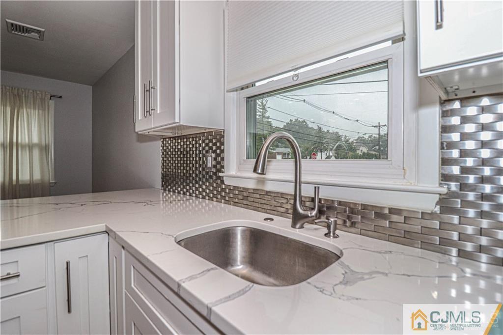 578 Chain O' Hills Road Colonia, NJ 07067 - Photo 4 of 39 a kitchen with a sink and a window