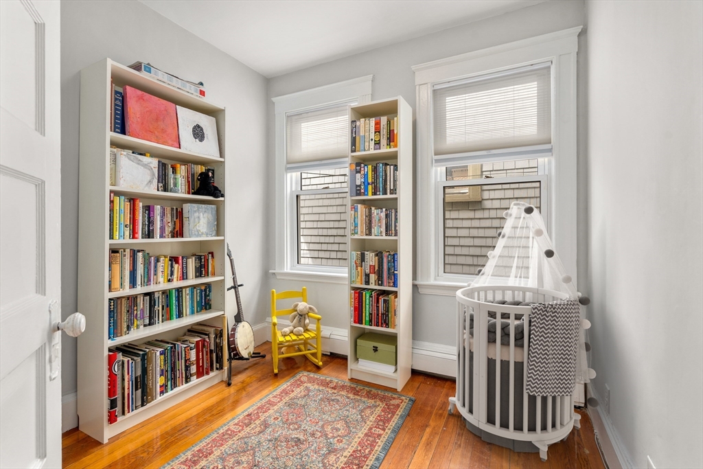 75 Brook Street, Unit 1 Brookline, MA 02445 - Photo 18 of 26 a view of a livingroom with furniture and windows