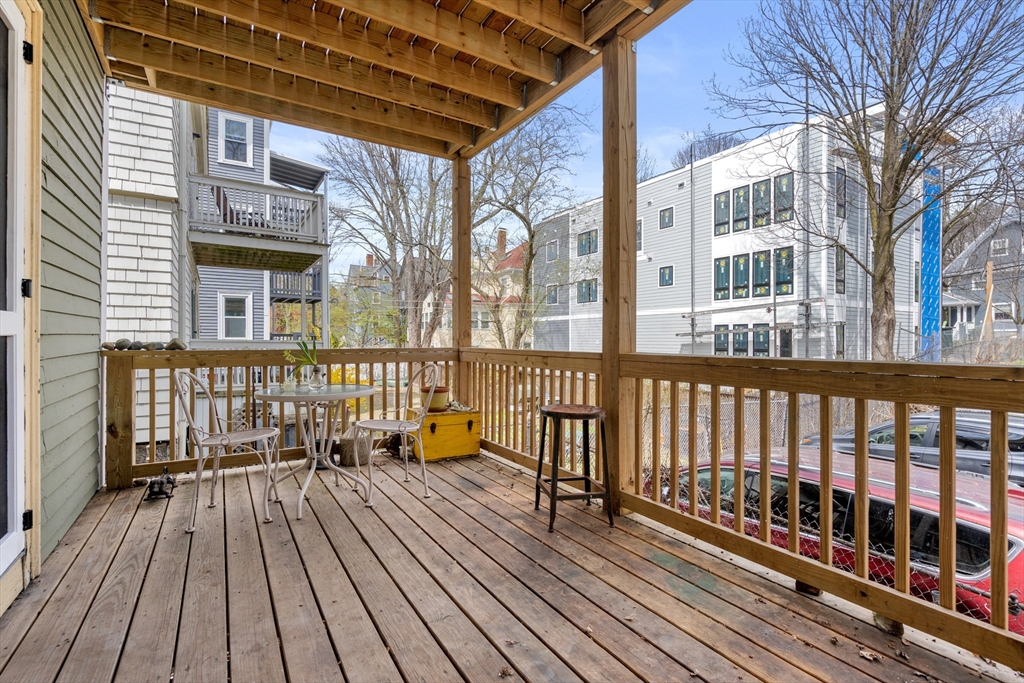 75 Brook Street, Unit 1 Brookline, MA 02445 - Photo 22 of 26 a view of a brick building from a balcony