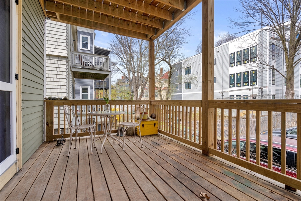 75 Brook Street, Unit 1 Brookline, MA 02445 - Photo 23 of 26 a view of a brick building from a balcony
