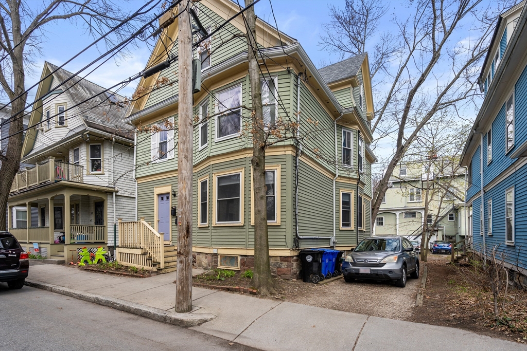 75 Brook Street, Unit 1 Brookline, MA 02445 - Photo 3 of 26 a view of a car park in front of a building