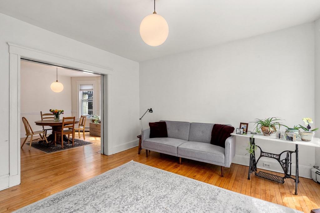 75 Brook Street, Unit 1 Brookline, MA 02445 - Photo 5 of 26 a living room with furniture and a wooden floor