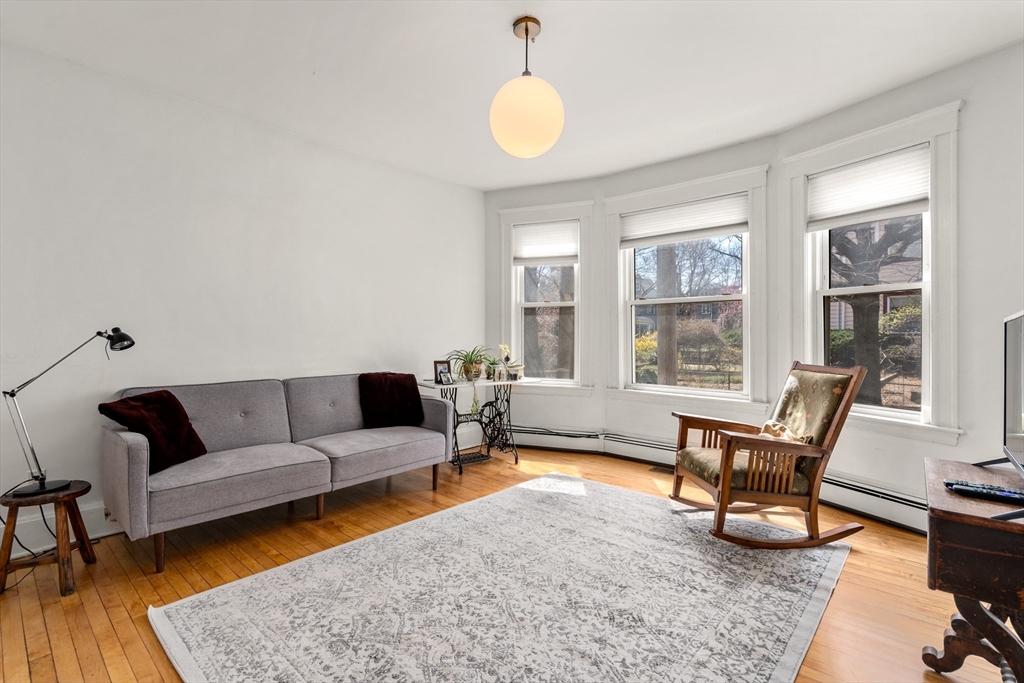 75 Brook Street, Unit 1 Brookline, MA 02445 - Photo 6 of 26 a living room with furniture and a large window