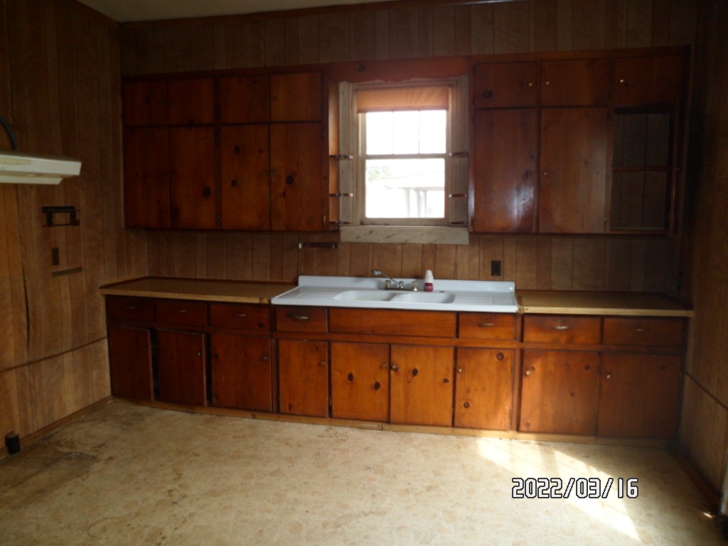 1004 Cheatham Street, Unit A Springfield, TN 37172 - Photo 8 of 12 a kitchen with granite countertop a sink cabinets and a window
