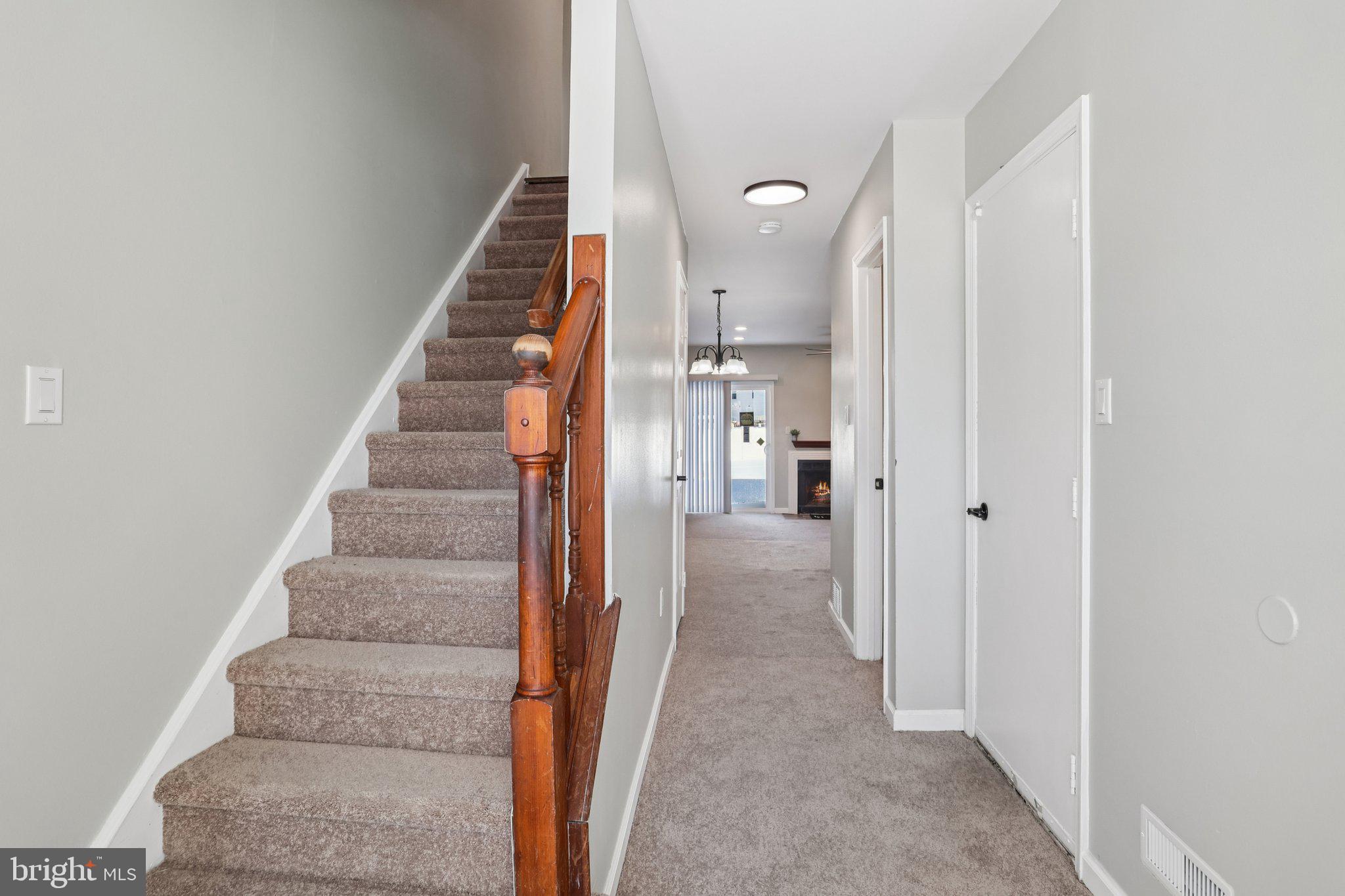 110 Auckland Drive Newark, DE 19702 - Photo 5 of 30 a view of a hallway with wooden floor and entryway