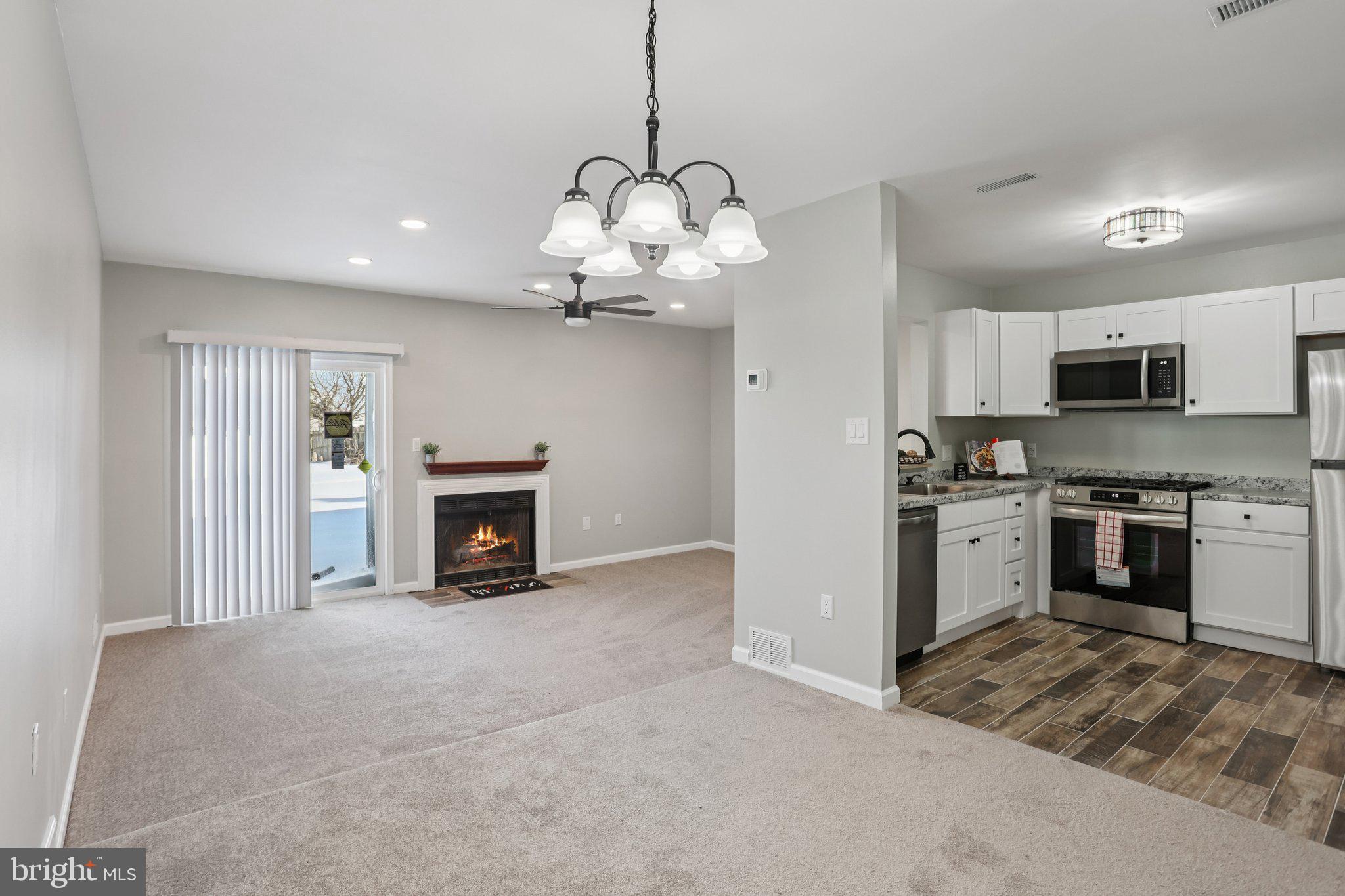 110 Auckland Drive Newark, DE 19702 - Photo 7 of 30 a view of a kitchen with a stove cabinets and a kitchen