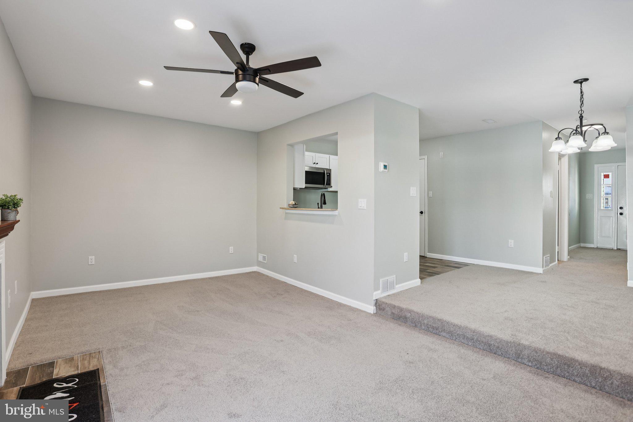 110 Auckland Drive Newark, DE 19702 - Photo 10 of 30 a view of an empty room with a ceiling fan