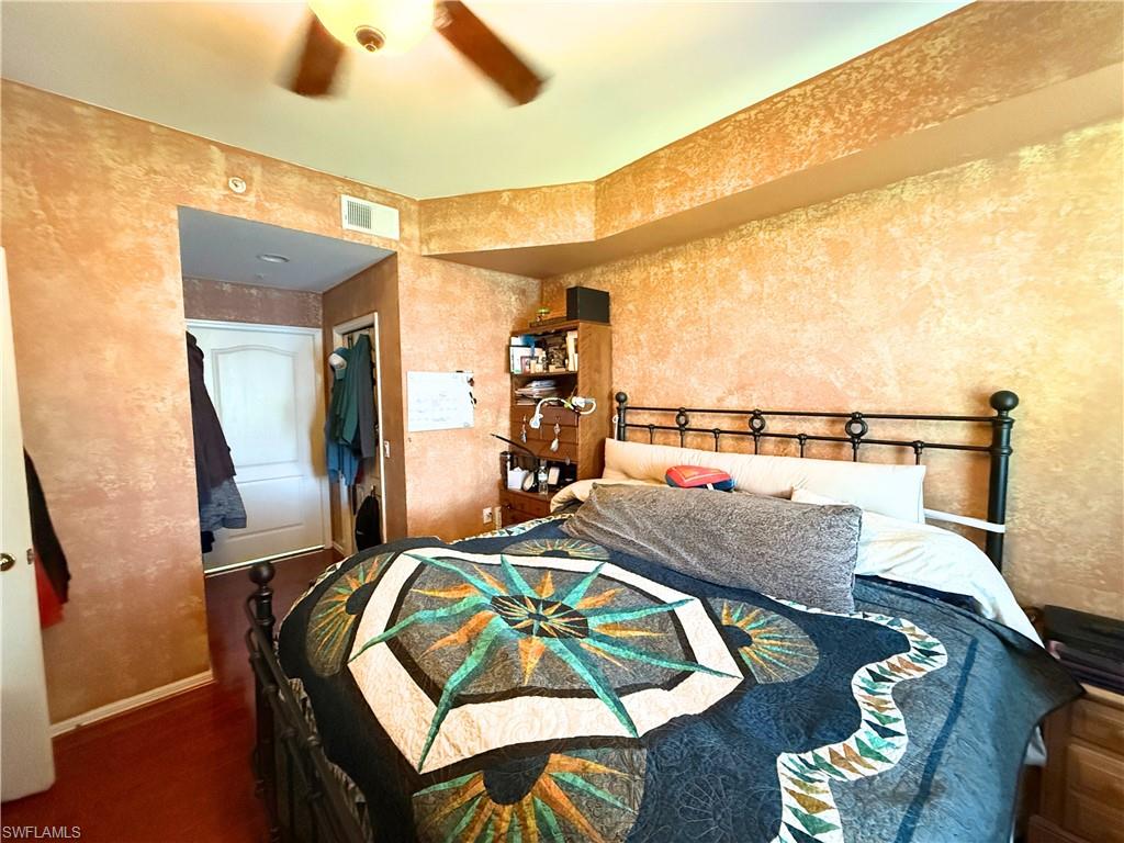 8490 Kingbird Loop, Unit 930 Estero, FL 33967 - Photo 5 of 12 Bedroom with wood finished floors and a ceiling fan