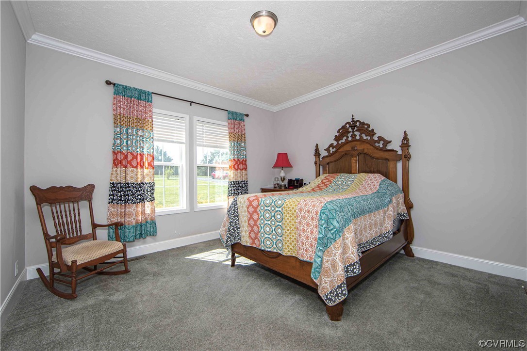617 Mohawk Road Buckingham, VA 23921 - Photo 13 of 26 a bedroom with a bed and a couch
