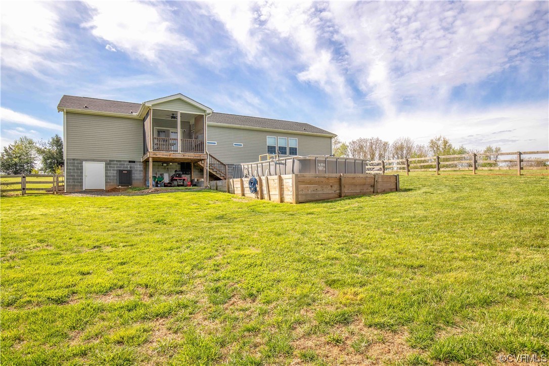 617 Mohawk Road Buckingham, VA 23921 - Photo 24 of 26 a view of a house with a swimming pool and a big yard
