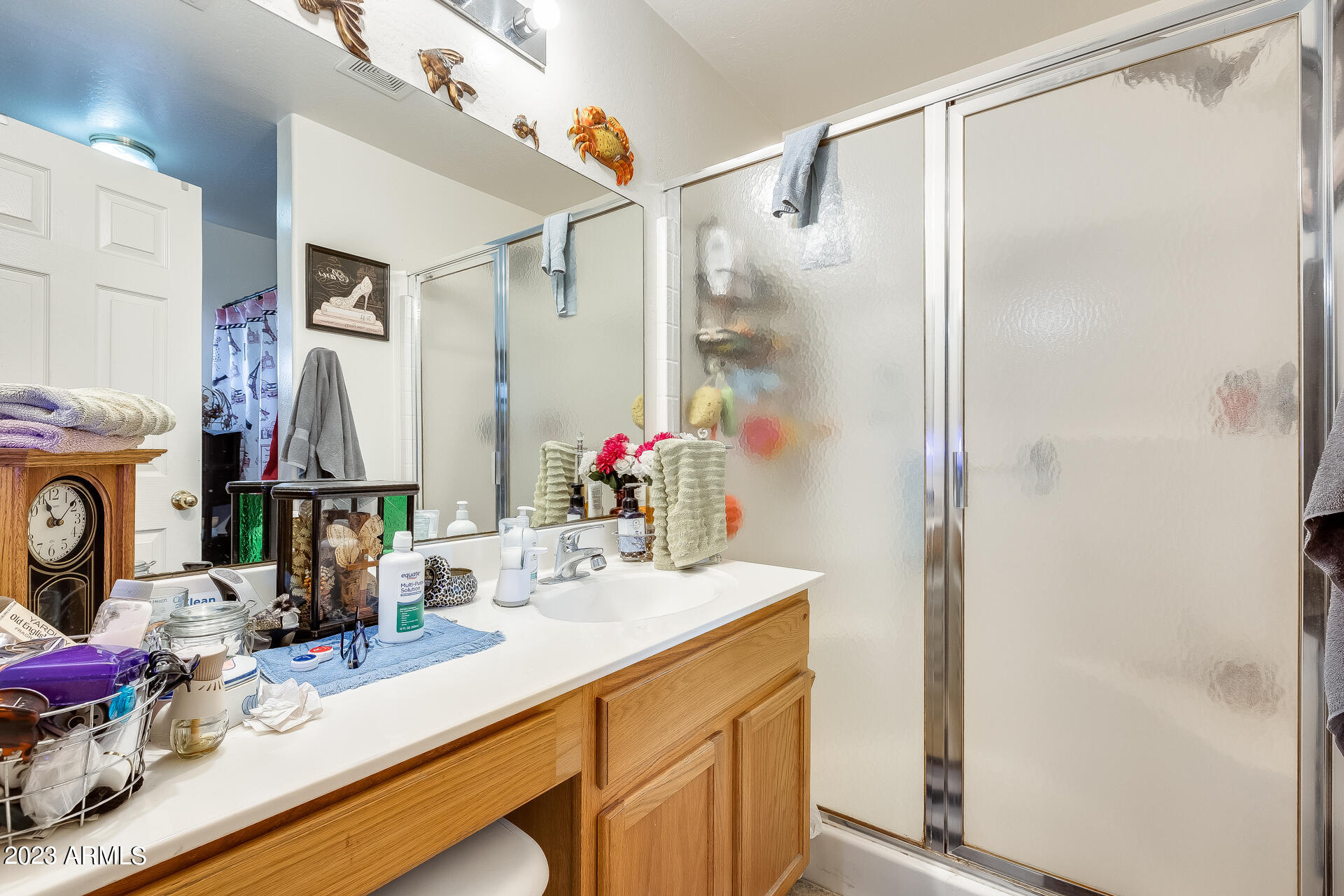 12722 West Boca Raton Road El Mirage, AZ 85335 - Photo 28 of 36 a bathroom with a double vanity sink mirror and shower