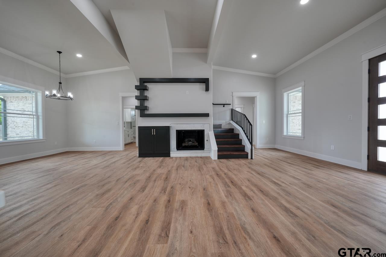 19383 Ridge Point Circle Lindale, TX 75771 - Photo 6 of 48 an empty room with wooden floor and window