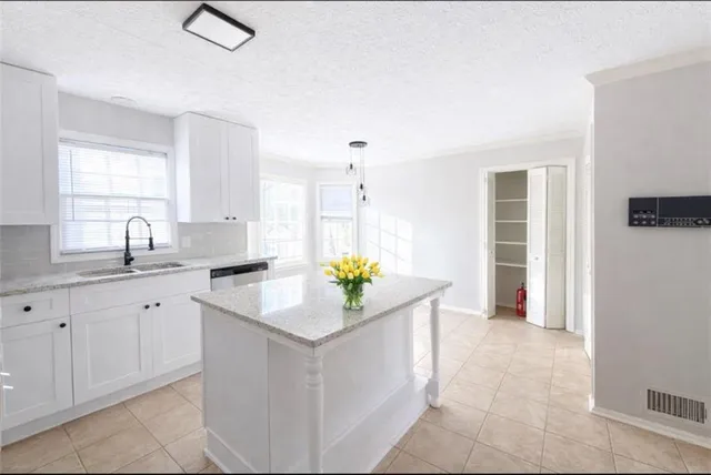 a kitchen with sink and window