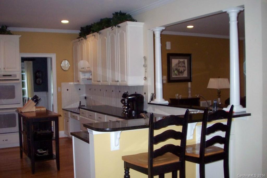 914 Haddonfield Drive, Unit 10 Fort Mill, SC 29708 - Photo 11 of 24 a kitchen with a table chairs and a refrigerator
