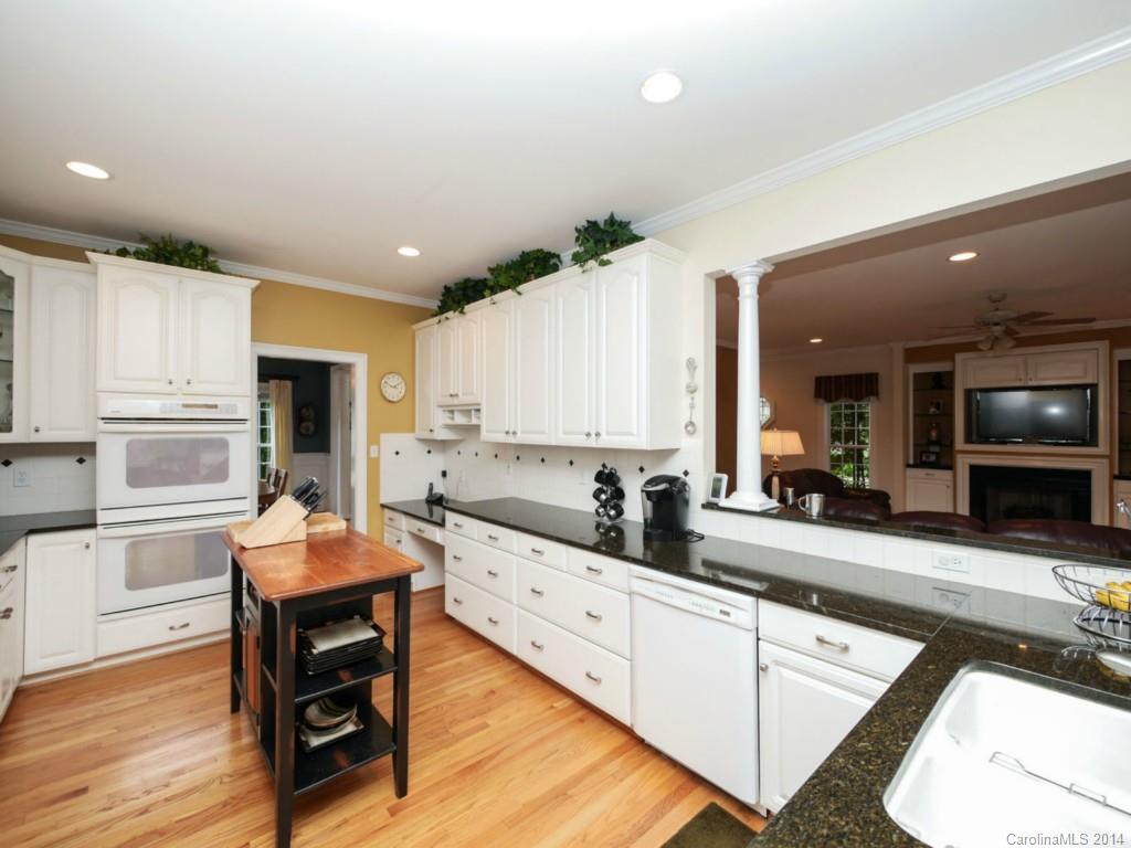 914 Haddonfield Drive, Unit 10 Fort Mill, SC 29708 - Photo 12 of 24 a large kitchen with kitchen island a large counter top space and stainless steel appliances