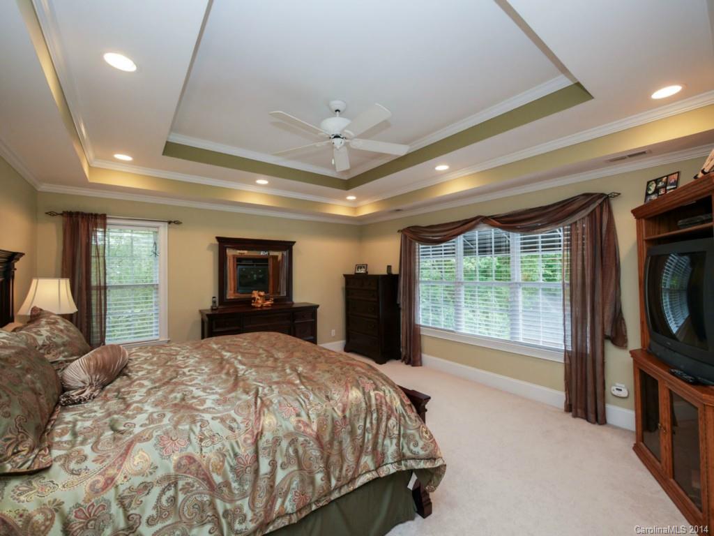 914 Haddonfield Drive, Unit 10 Fort Mill, SC 29708 - Photo 17 of 24 a bed sitting in a spacious bedroom next to a window