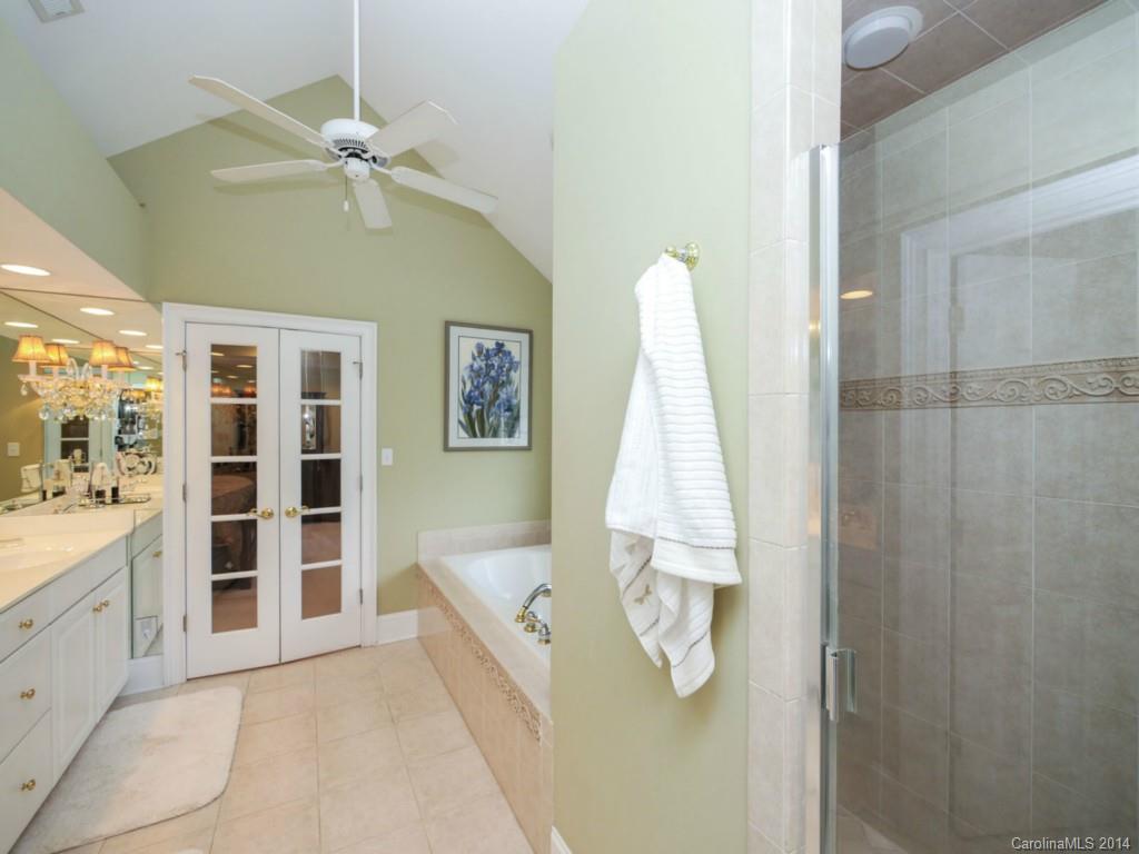 914 Haddonfield Drive, Unit 10 Fort Mill, SC 29708 - Photo 18 of 24 a view of a bathroom with a tub and windows