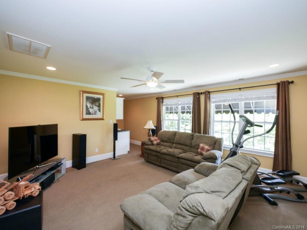 914 Haddonfield Drive, Unit 10 Fort Mill, SC 29708 - Photo 19 of 24 a living room with furniture and a flat screen tv