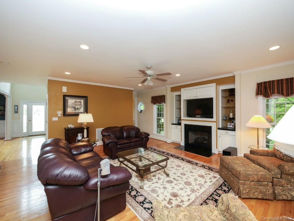 914 Haddonfield Drive, Unit 10 Fort Mill, SC 29708 - Photo 8 of 24 a living room with furniture a flat screen tv and a fireplace