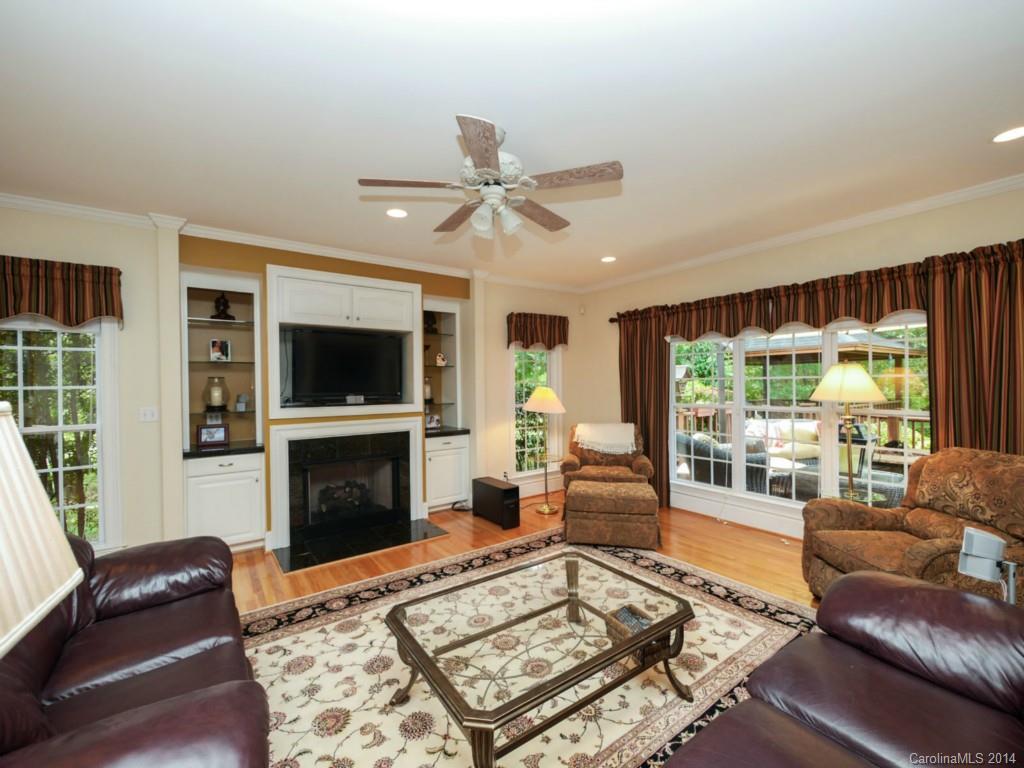 914 Haddonfield Drive, Unit 10 Fort Mill, SC 29708 - Photo 9 of 24 a living room with furniture a flat screen tv and a fireplace