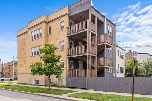 a view of a building with a yard