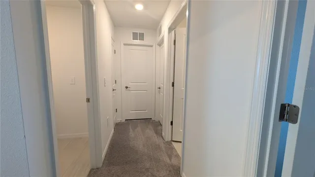 a room with furniture a rug and a window