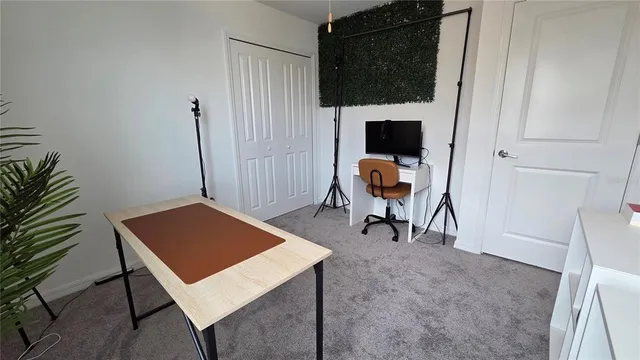 a bedroom with a bed and chandelier