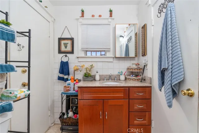 a white toilet sitting next to a bathroom