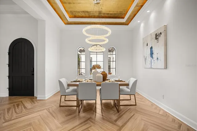 a kitchen with stainless steel appliances granite countertop a sink and a refrigerator