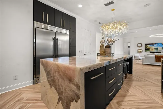 a spacious bedroom with a bed and a large window