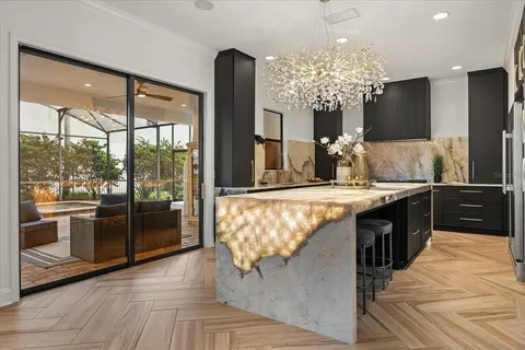 $1,299,900 | 7733 Pointe Venezia Drive, Orlando, FL 32836