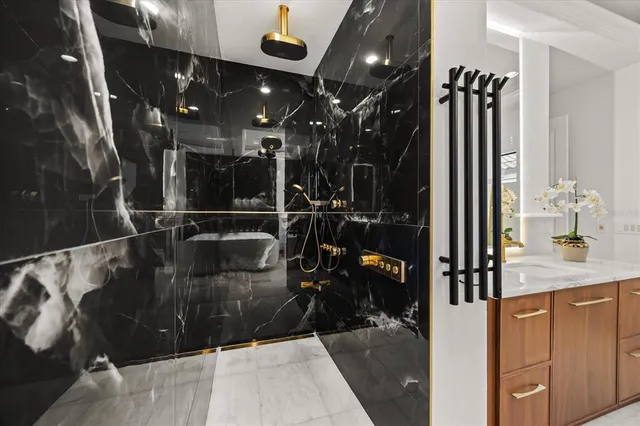 a view of swimming pool with a lounge chairs