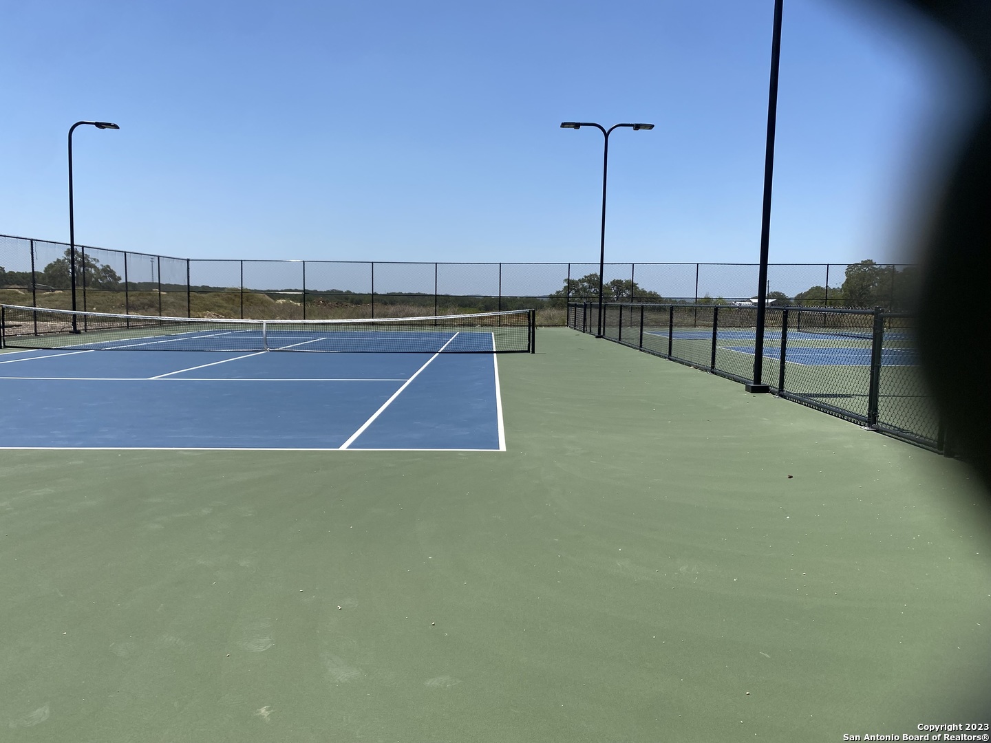 930 Maximino Ridge Rd. Bulverde, TX 78163 - Photo 18 of 18 a view of a tennis court